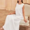 An elegant vest-style dress, which can be worn as an inner layer of Abaya, with a lustrous satin fabric